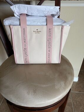 kate spade cream canvas tote with pink trim and straps